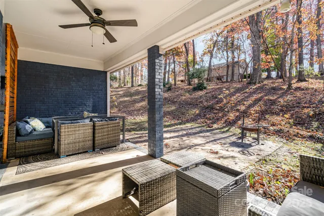 a view of a terrace with couches and wooden floor