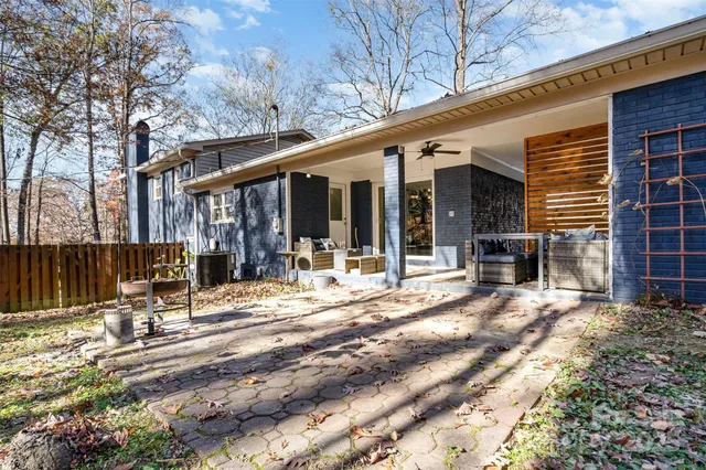 a view of a building with sitting area and roof