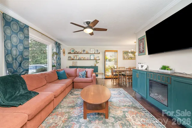 a living room with furniture fireplace and a flat screen tv