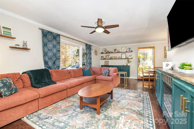 a living room with furniture fireplace and a flat screen tv