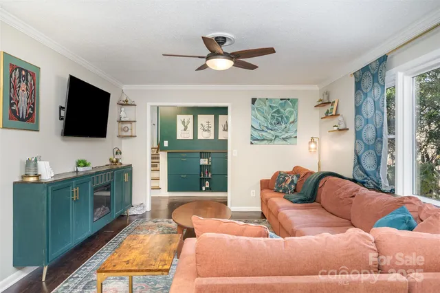 a living room with furniture and a flat screen tv