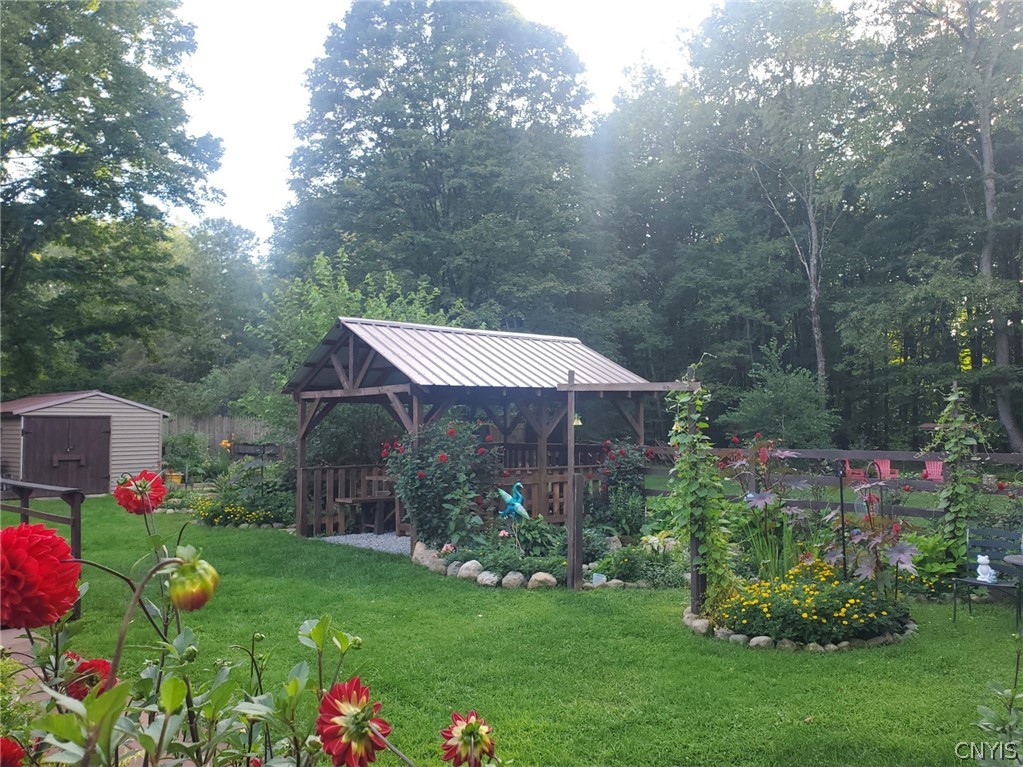 1053 Grant Road Russia, NY 13324 - Photo 35 of 47 Lush landscaping and a detached wooden gazebo defi
