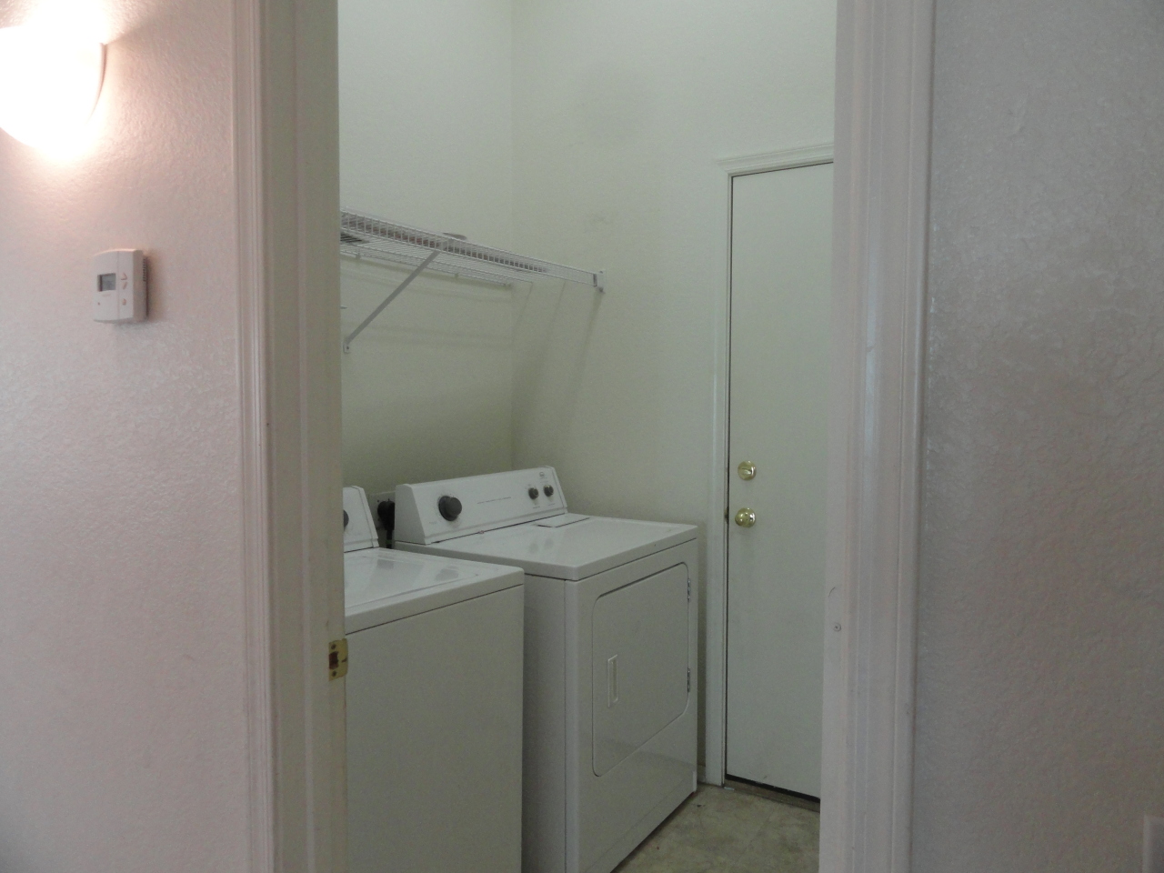 12913 West Cheery Lynn Road Avondale, AZ 85392 - Photo 13 of 15 UTILITY ROOM WITH SHELVES