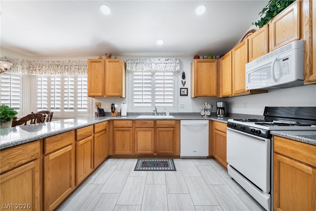 2141 Hidden Ranch Terrace Henderson, NV 89052 - Photo 10 of 28 Breakfast bar offers additional seating or the perfect space to serve food while entertaining