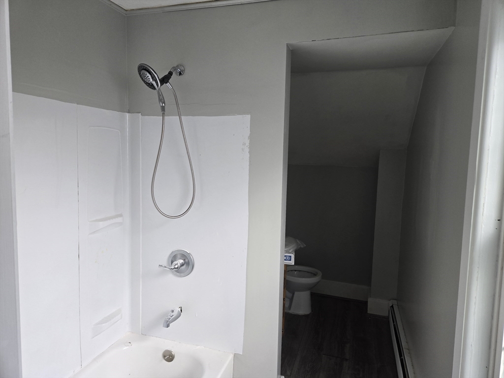 24 Caron Street Southbridge, MA 01550 - Photo 7 of 8 a bathroom with a glass shower door