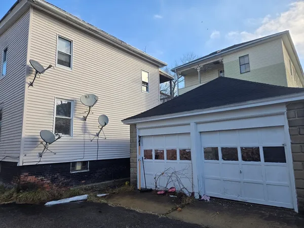 a front view of a house with a garage