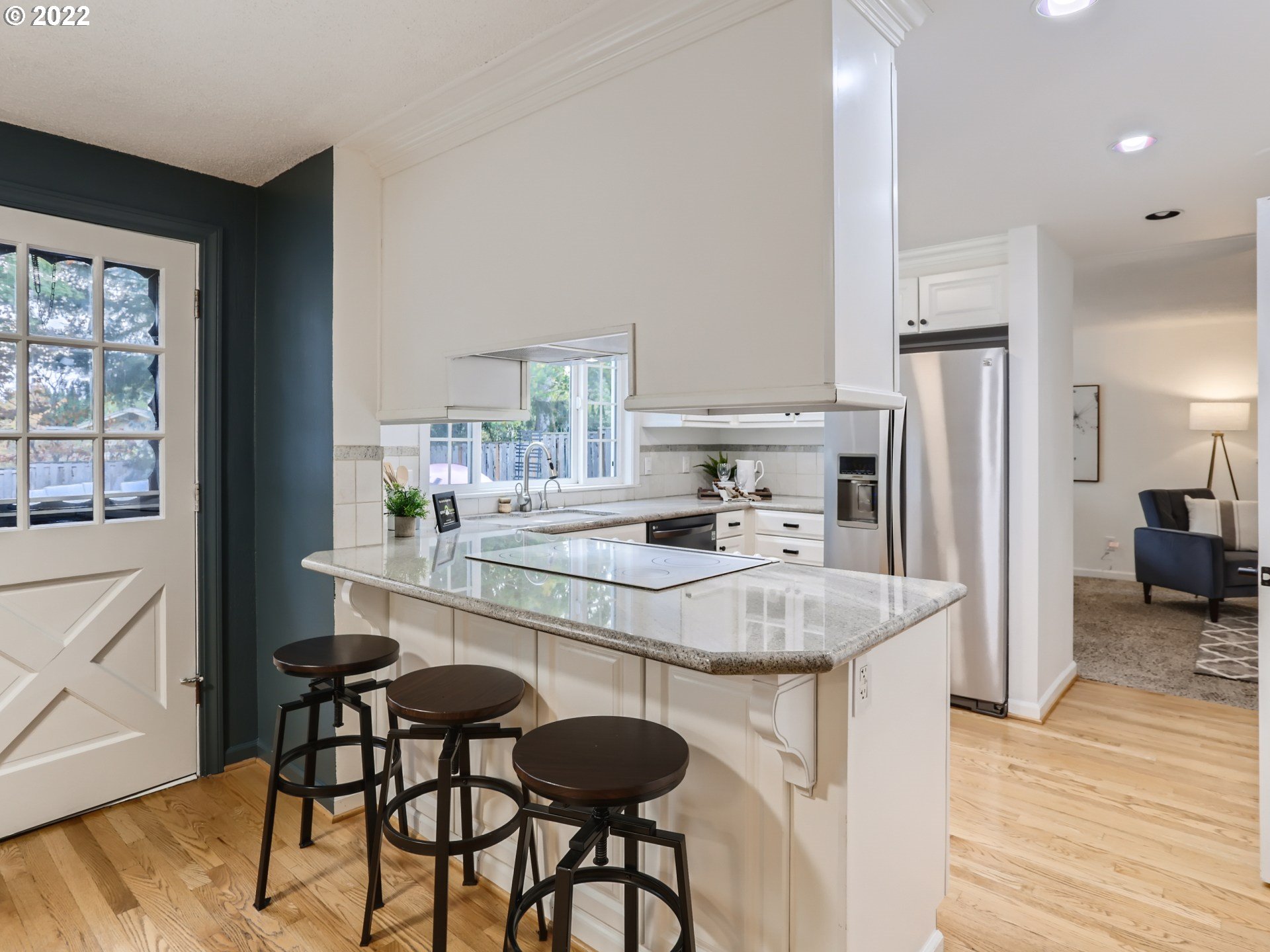 12300 Southwest Davies Road Beaverton, OR 97008 - Photo 13 of 31 a kitchen with stainless steel appliances granite countertop a sink and a refrigerator