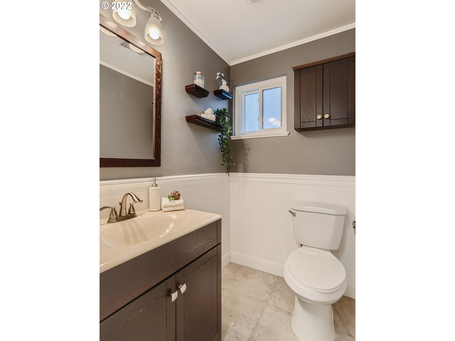 12300 Southwest Davies Road Beaverton, OR 97008 - Photo 18 of 31 a bathroom with a sink toilet and mirror