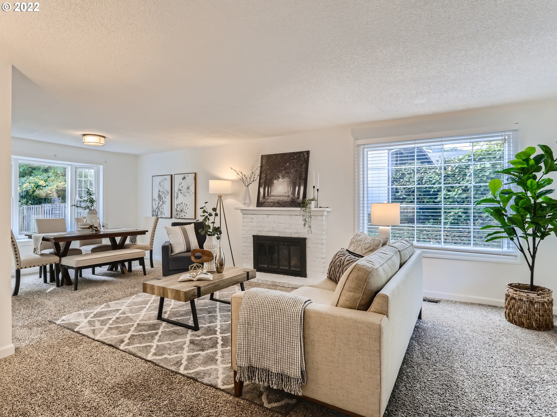 12300 Southwest Davies Road Beaverton, OR 97008 - Photo 2 of 31 a living room with furniture and a fireplace