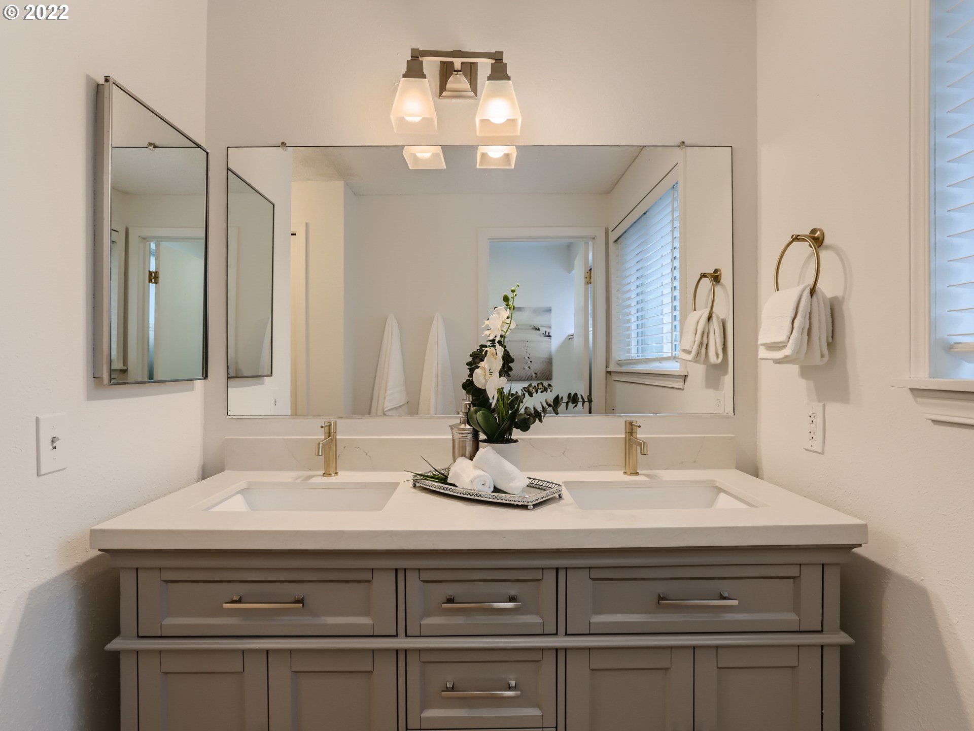 12300 Southwest Davies Road Beaverton, OR 97008 - Photo 21 of 31 a bathroom with a sink vanity and a mirror