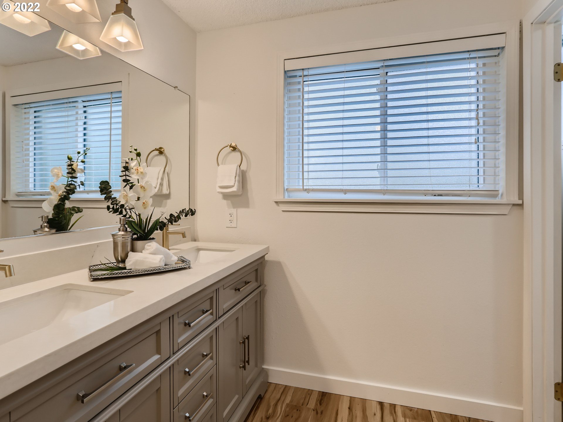 12300 Southwest Davies Road Beaverton, OR 97008 - Photo 23 of 31 a bathroom with a sink and a mirror