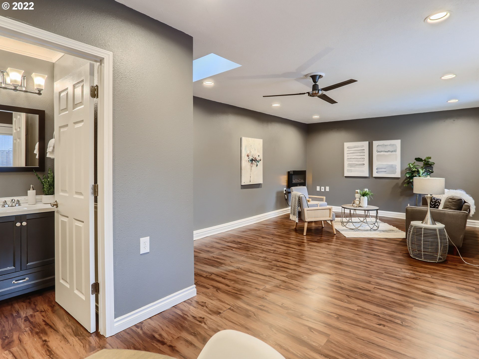 12300 Southwest Davies Road Beaverton, OR 97008 - Photo 28 of 31 a living room with furniture and a chandelier