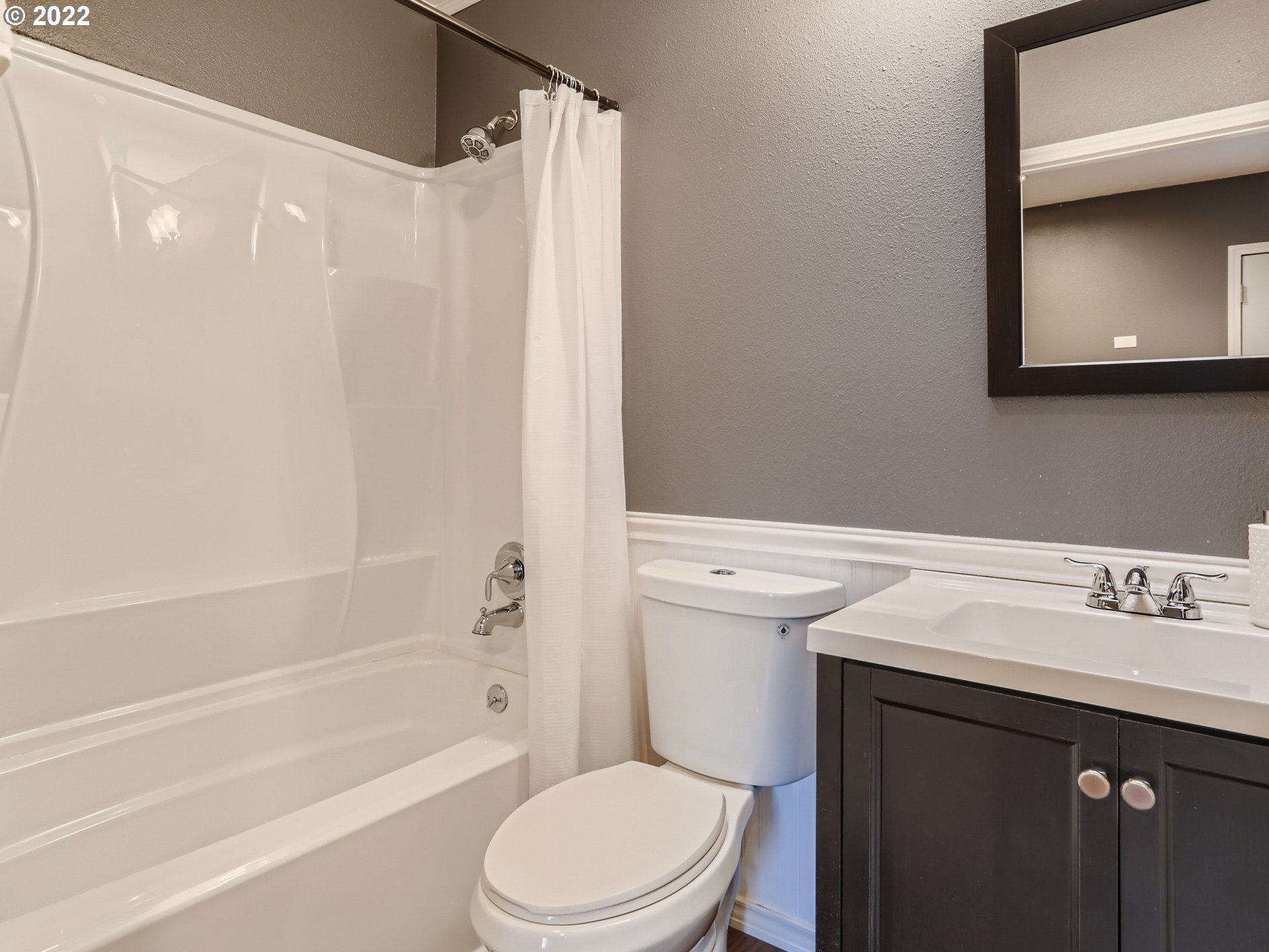 12300 Southwest Davies Road Beaverton, OR 97008 - Photo 29 of 31 a bathroom with a sink a toilet and shower