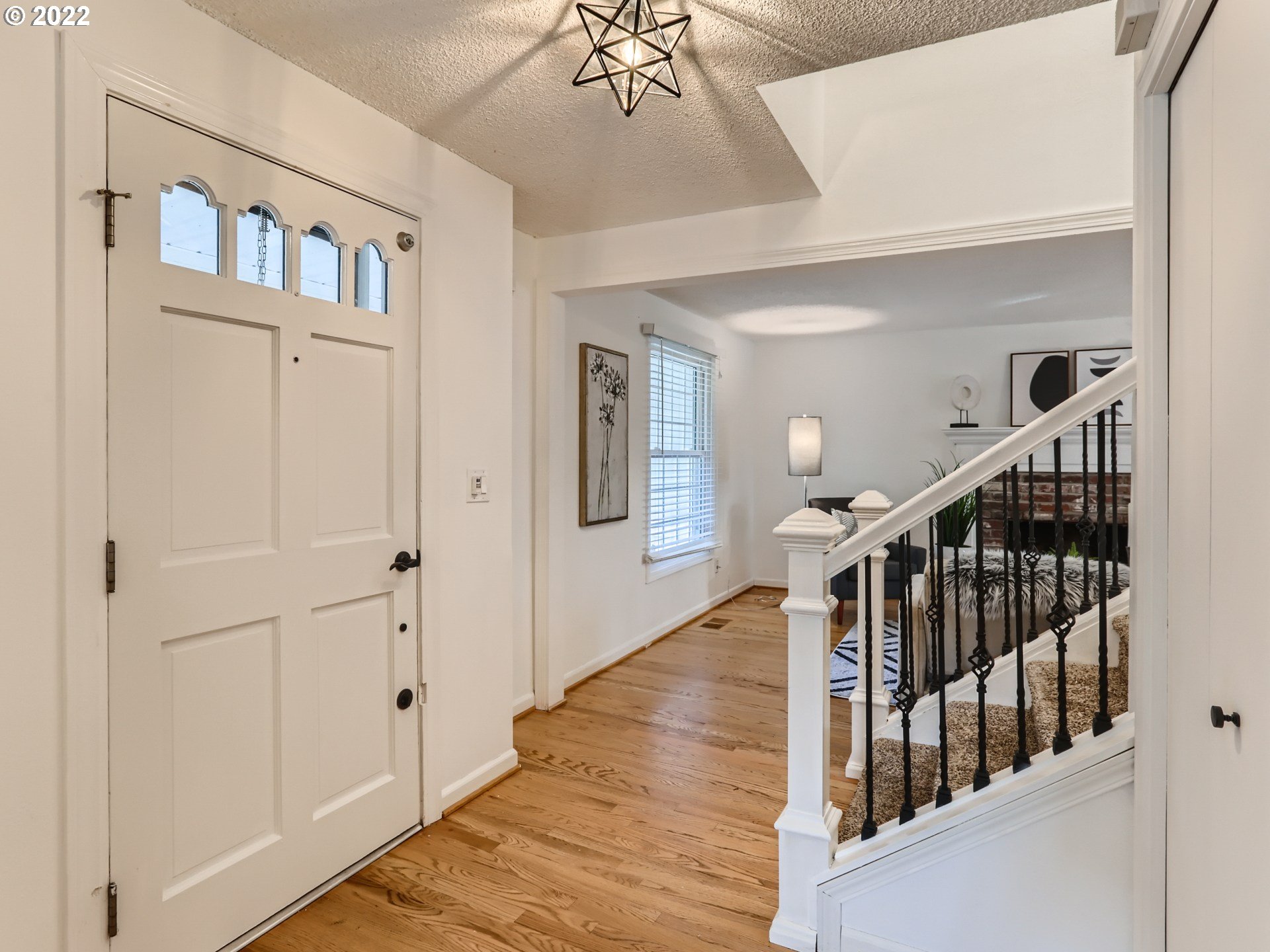 12300 Southwest Davies Road Beaverton, OR 97008 - Photo 7 of 31 a view of entryway with wooden floor