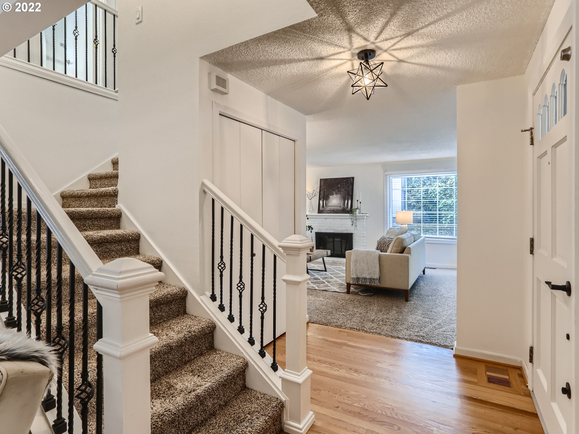 12300 Southwest Davies Road Beaverton, OR 97008 - Photo 8 of 31 a living room with furniture and a chandelier