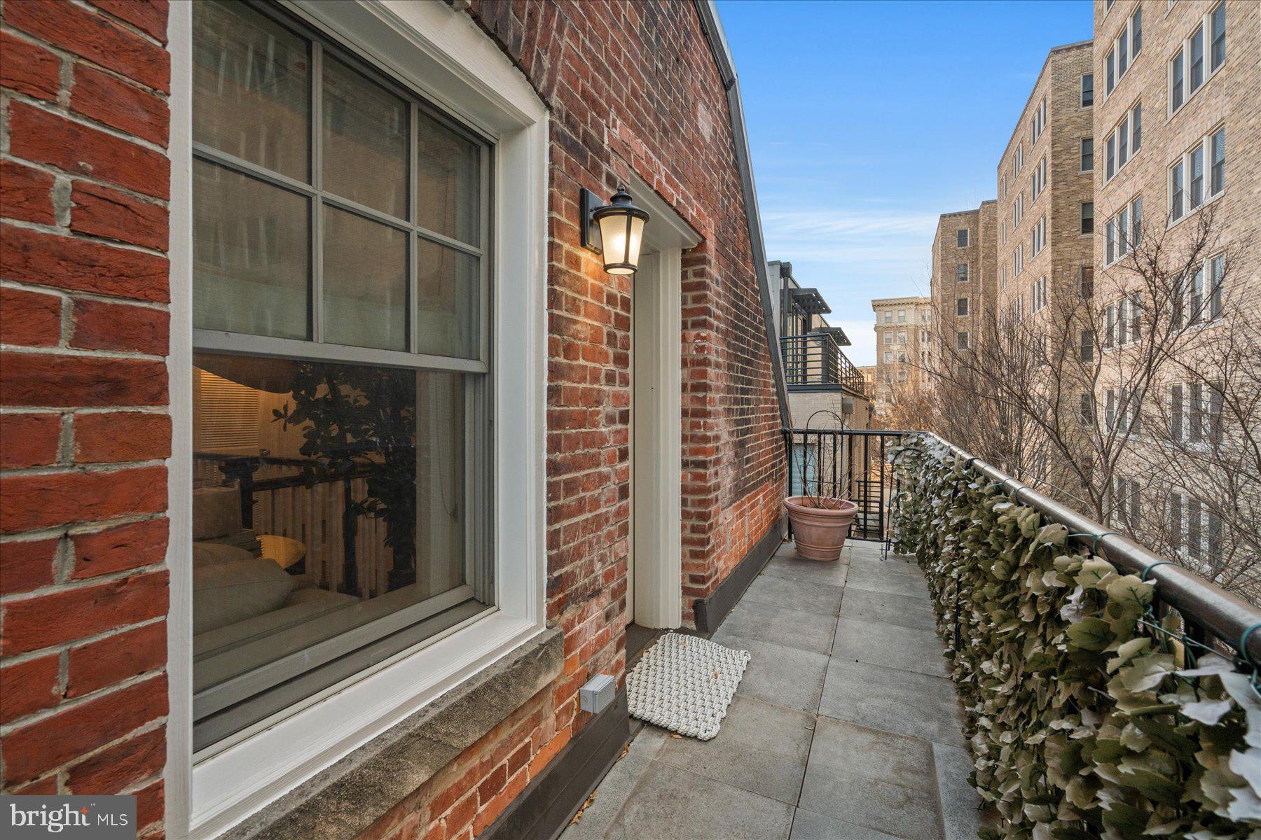 2014 Kalorama Road Northwest, Unit 7 Washington, DC 20009 - Photo 11 of 23 a view of balcony with wooden floor and a potted plant