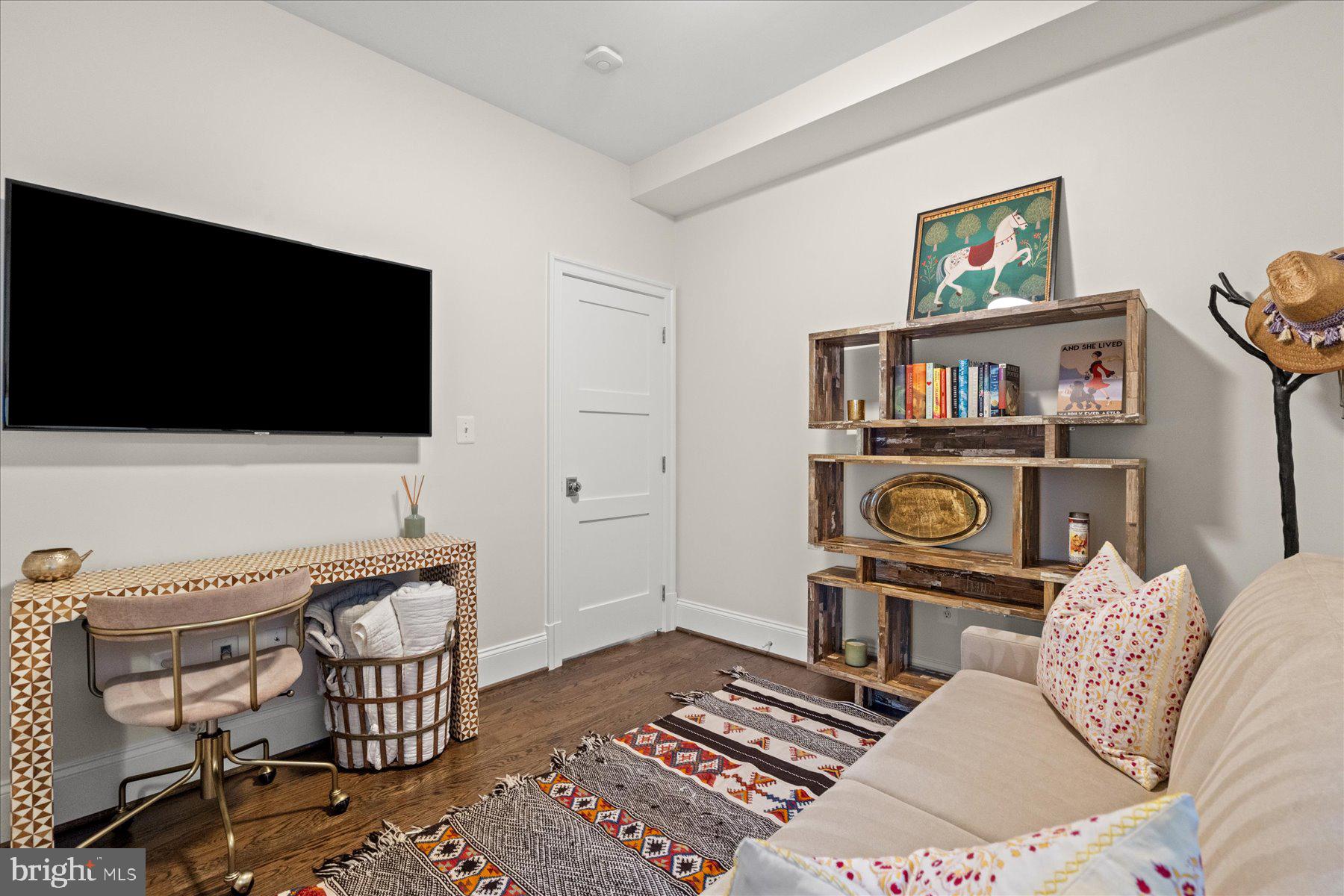 2014 Kalorama Road Northwest, Unit 7 Washington, DC 20009 - Photo 21 of 23 a living room with furniture a flat screen tv and rug