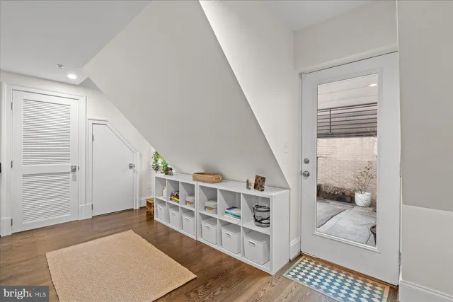 a living room with furniture and a rug