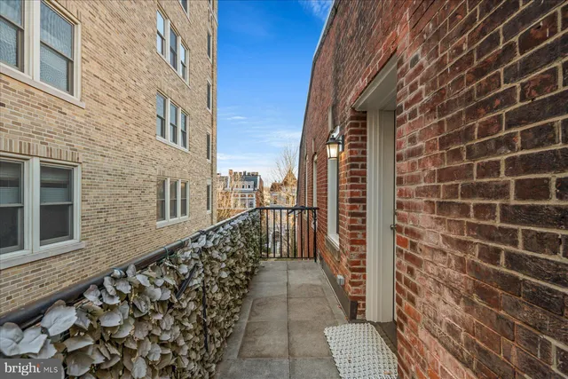 a view of balcony with wooden floor and a potted plant