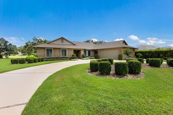 a view of a house with a big yard