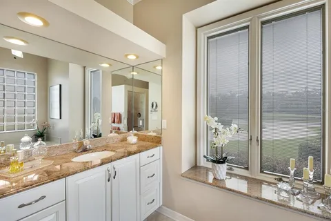 a bathroom with a tub shower and sink