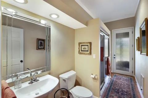 a utility room with sink dryer and washer