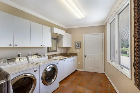 a view of a livingroom with furniture and a kitchen view