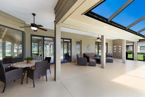 a view of a backyard with basketball court