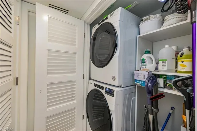 a patio with wooden floor a yard a table and chairs