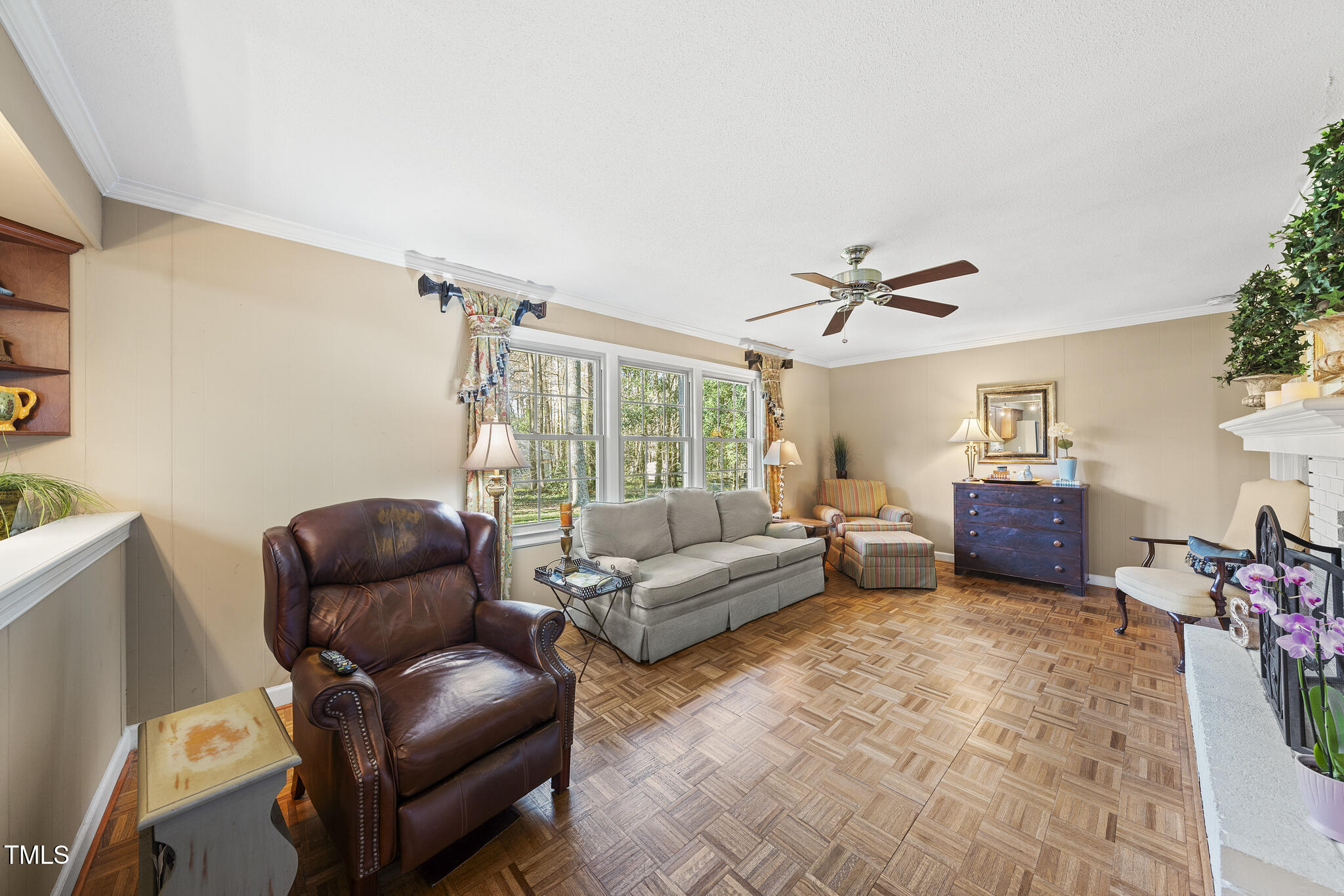 11801 Strickland Road Raleigh, NC 27613 - Photo 15 of 38 a living room with furniture and a large window