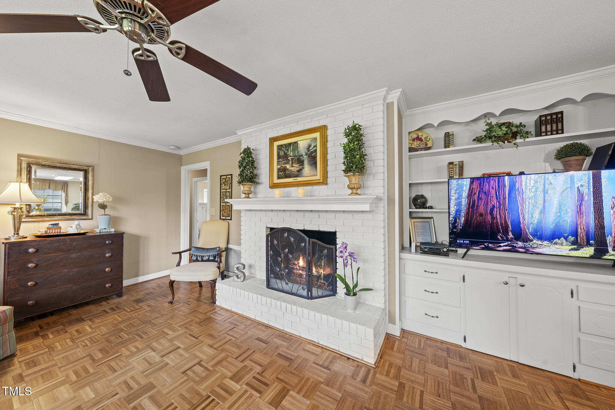11801 Strickland Road Raleigh, NC 27613 - Photo 16 of 38 a living room with furniture and a fireplace