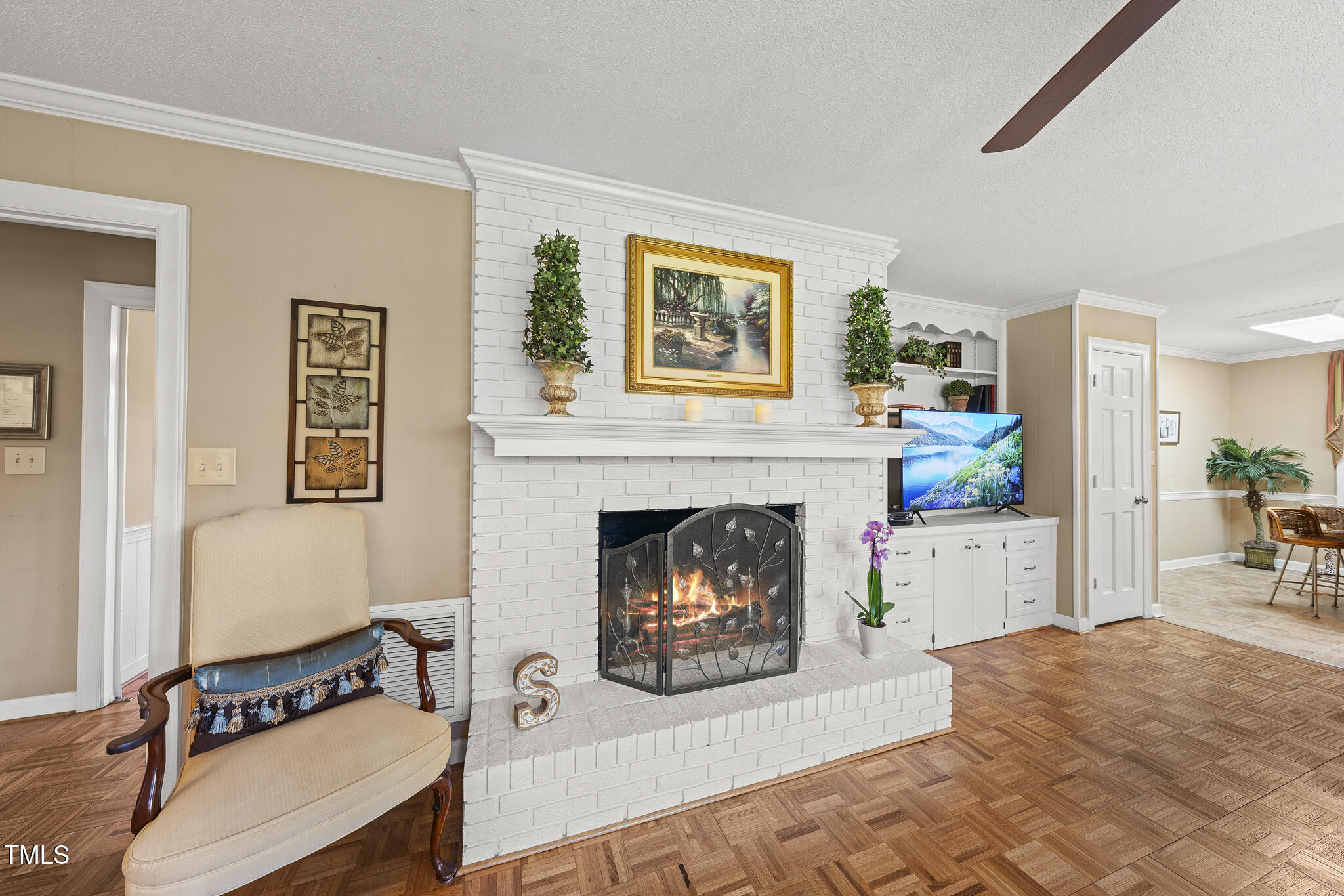 11801 Strickland Road Raleigh, NC 27613 - Photo 26 of 38 a living room with furniture and a fireplace