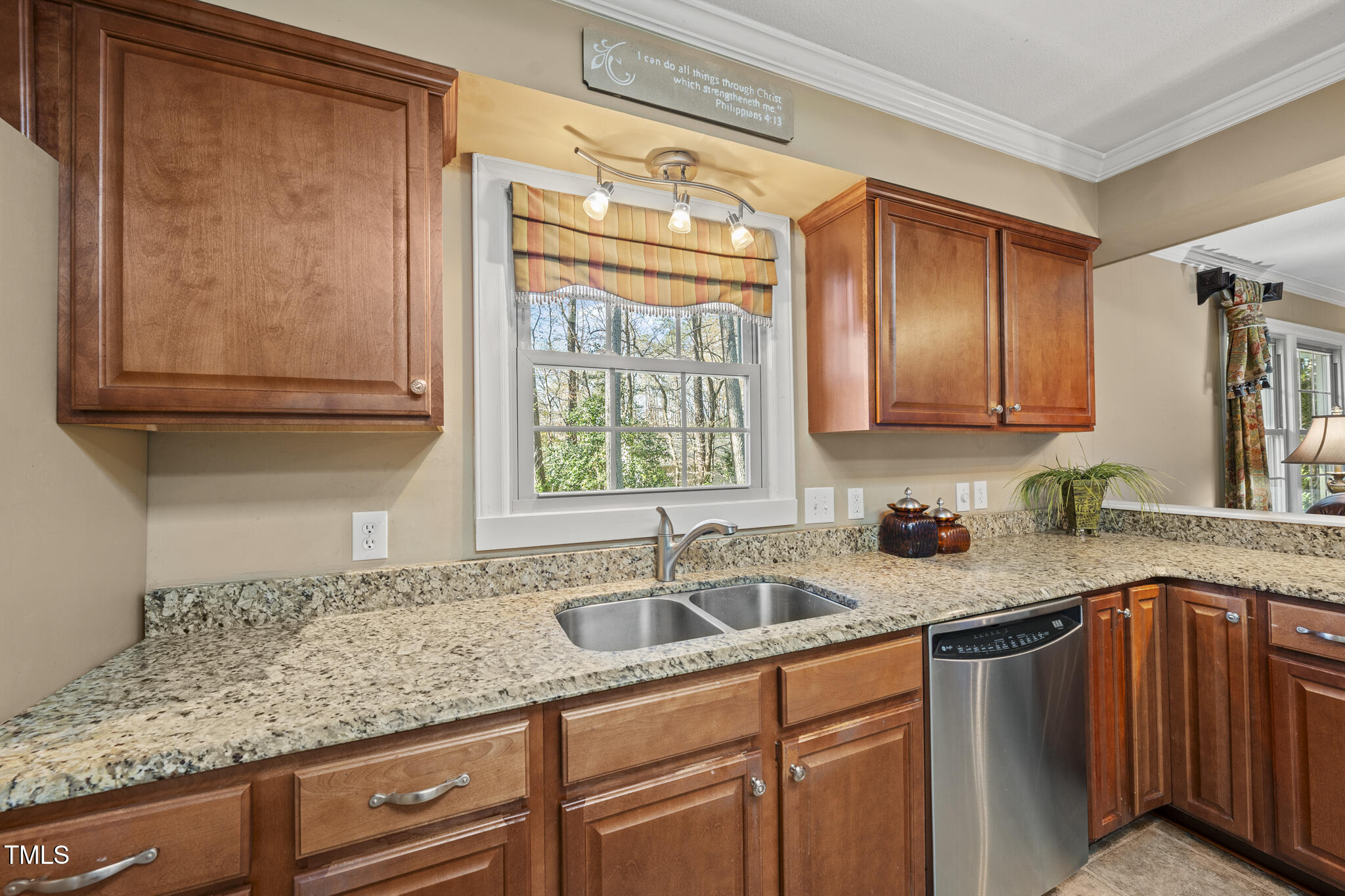 11801 Strickland Road Raleigh, NC 27613 - Photo 32 of 38 a kitchen with sink cabinets and window