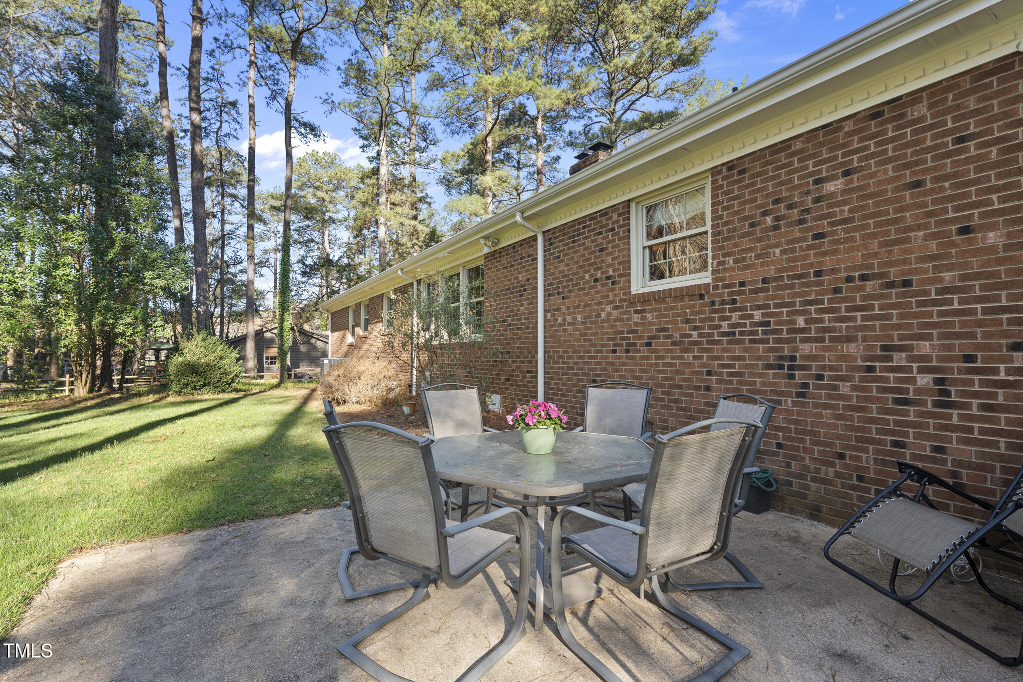 11801 Strickland Road Raleigh, NC 27613 - Photo 34 of 38 a view of backyard with seating space and trees