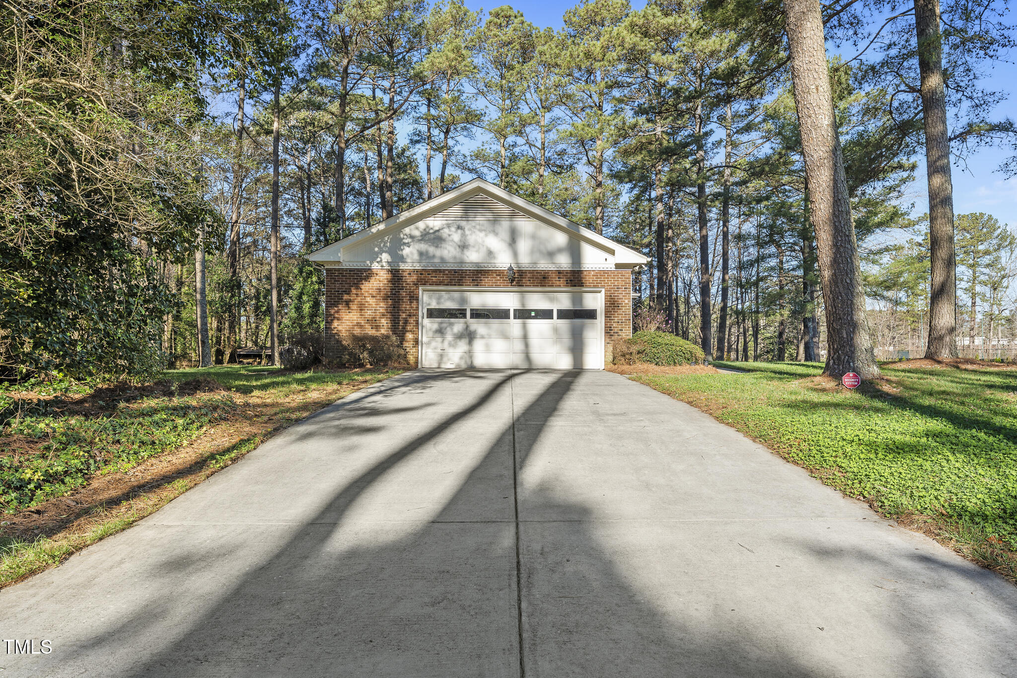 11801 Strickland Road Raleigh, NC 27613 - Photo 4 of 38 a view of house with yard and green space
