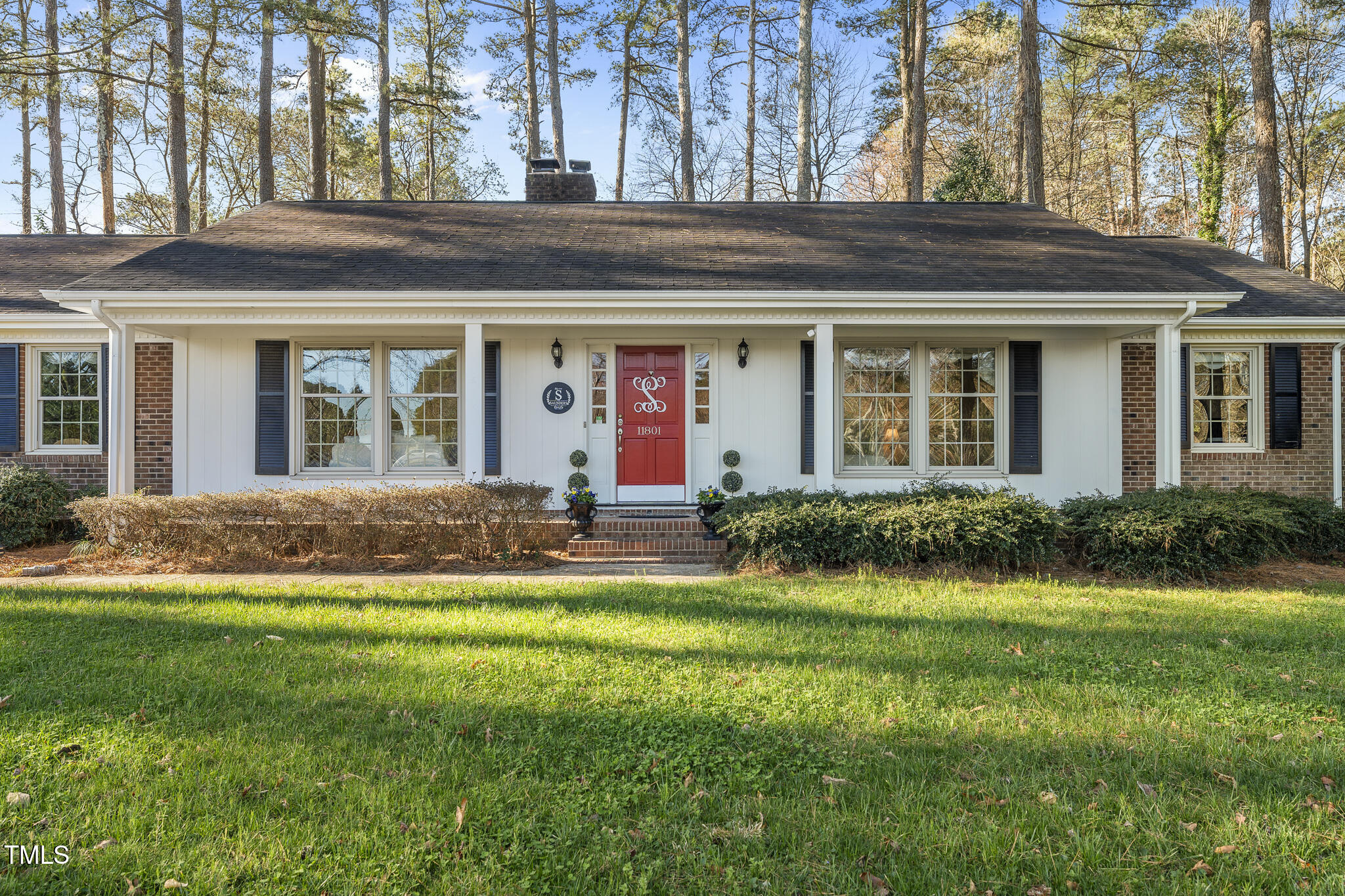 11801 Strickland Road Raleigh, NC 27613 - Photo 5 of 38 front view of house with a yard