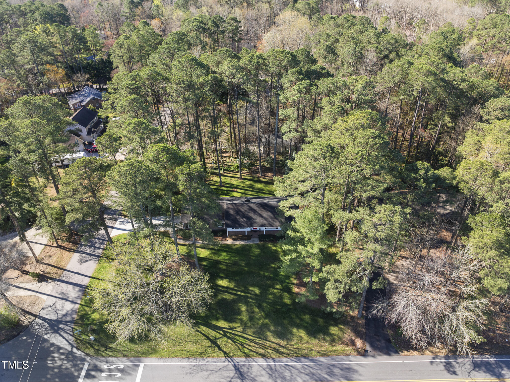 11801 Strickland Road Raleigh, NC 27613 - Photo 6 of 38 a view of residential house and tree