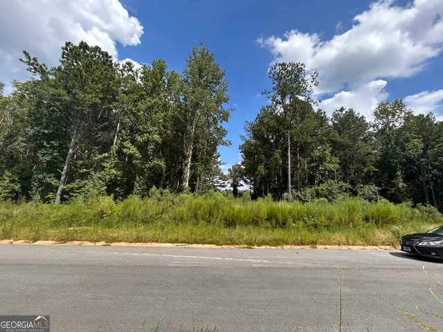 a view of a street with sitting area