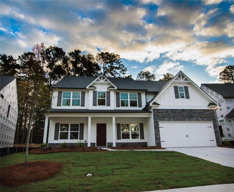 1 River Run Drive Dallas, GA 30132 - Photo 1 of 1 a front view of a house with a garden