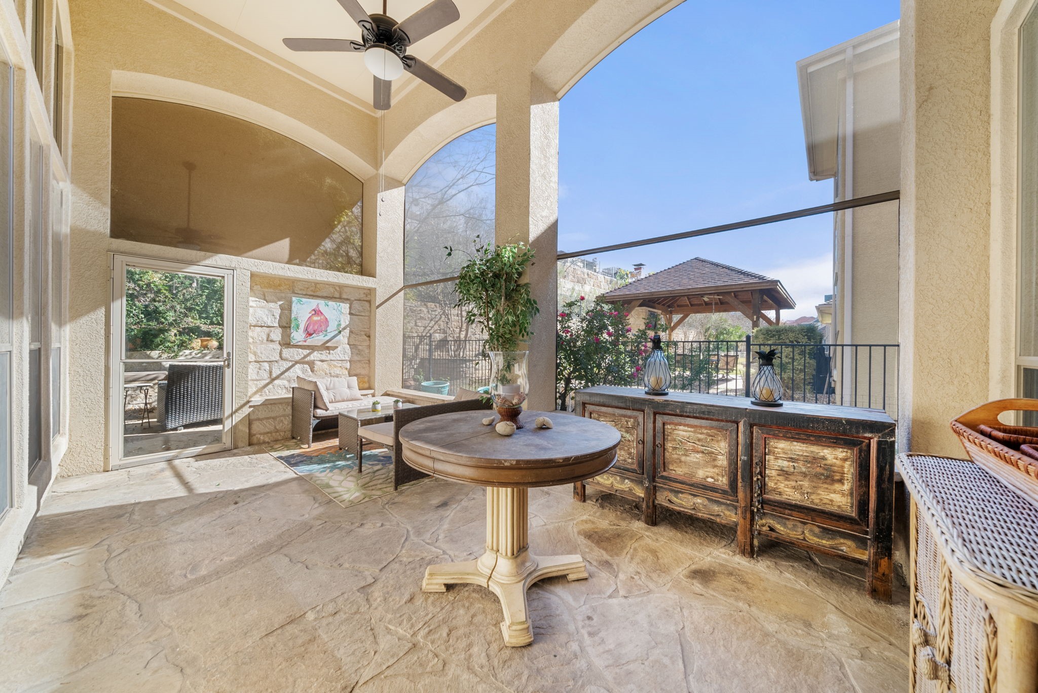 122 Sebastians Run Austin, TX 78738 - Photo 31 of 39 Screened in patio off of kitchen/family room and opens to garden patio and back yard
