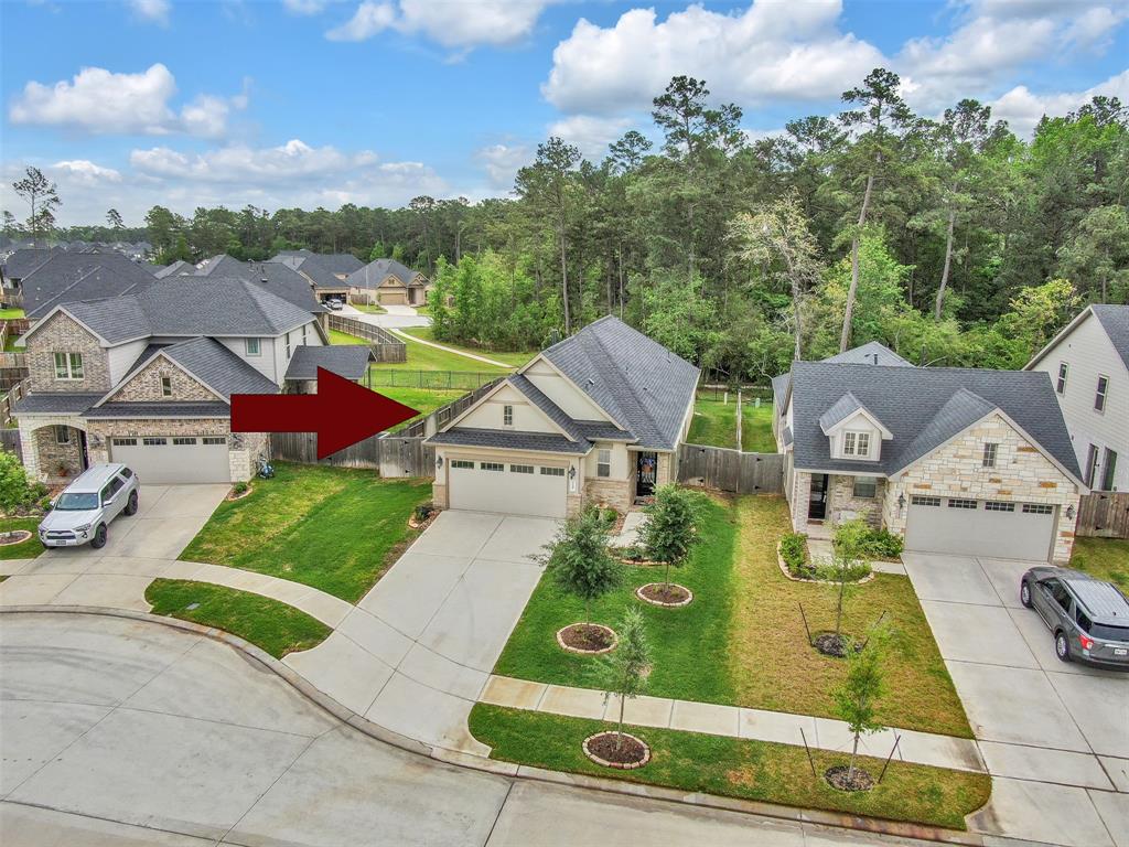 Located in the Master Planned Community is this 4 bedroom 2.5 bath home!  Situated in the back of the neighborhood with no rear neighbors.  Views of the many trails and wooded areas of Woodtrace.  Zoned to Exemplary Tomball ISD!
