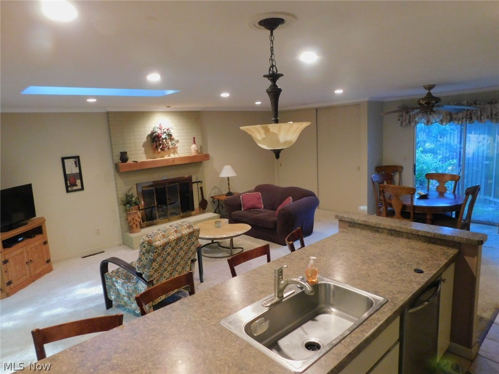 Family room has gas fireplace and dining area.