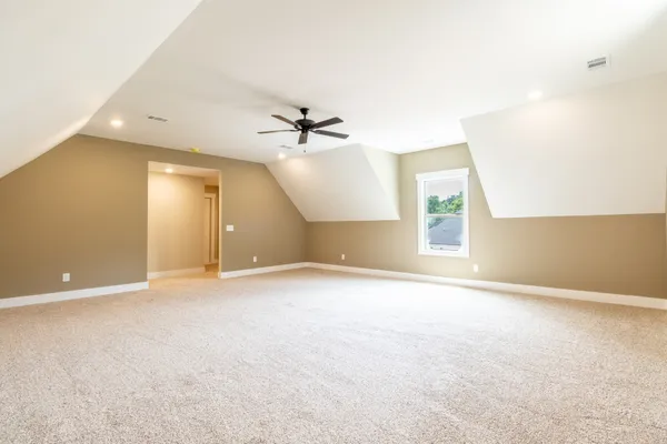 an empty room with a empty space and windows