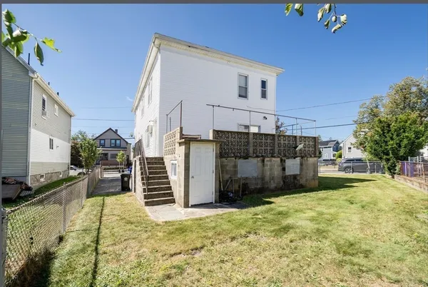 a view of a backyard of the house