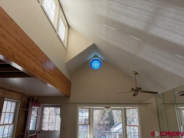 a living room with furniture a window and a fireplace