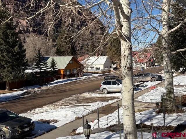 a view of a patio with table and chairs