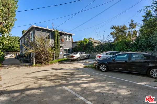 a view of a car parked in front of a house