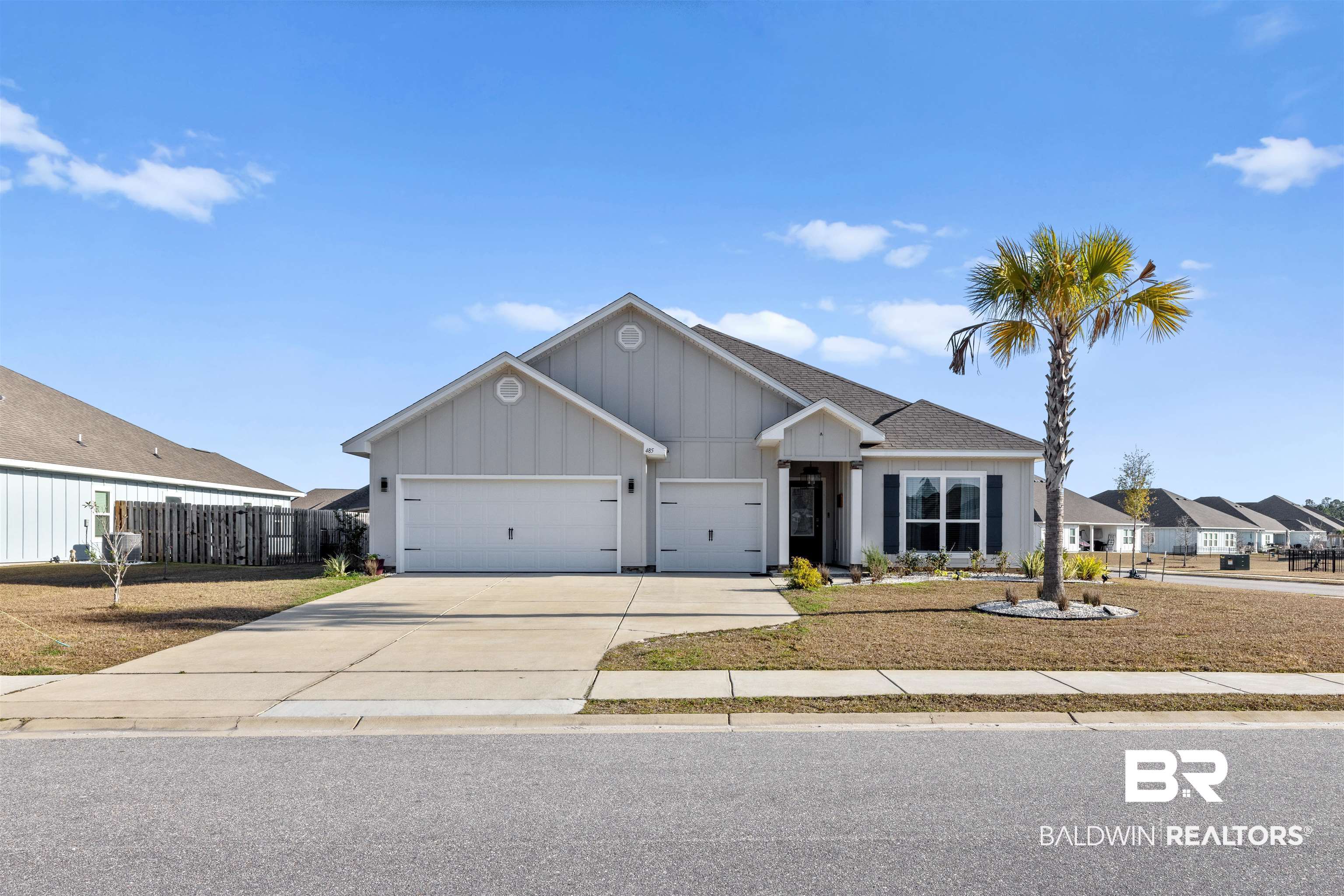 485 Shepard Street Gulf Shores, AL 36542 - Photo 41 of 53 Ranch-style home featuring board and batten siding, driveway, an attached garage, and a shingled roof