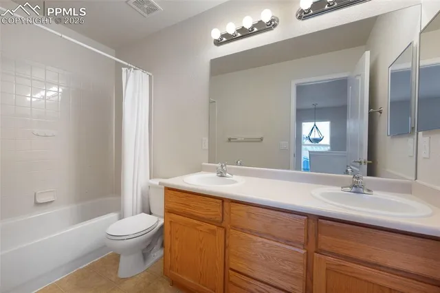 a bathroom with a sink vanity granite toilet tub and shower