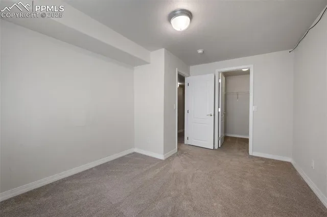 an empty room with closet area